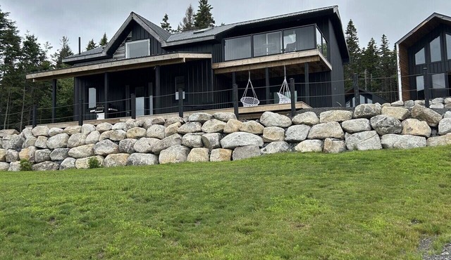 A modern three bedroom house with skywalk; perched at the highest topographic point of the estate. in Riverport