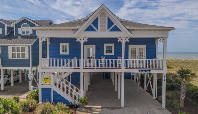 Experience oceanfront luxury at Sur La Mer, a 5-bedroom dog-friendly retreat with a private pool. in Holden Beach