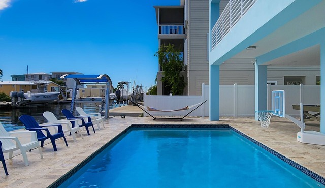 Sprawling waterfront home with pool, outdoor kitchen, game table, grill, & W/D in Key Largo