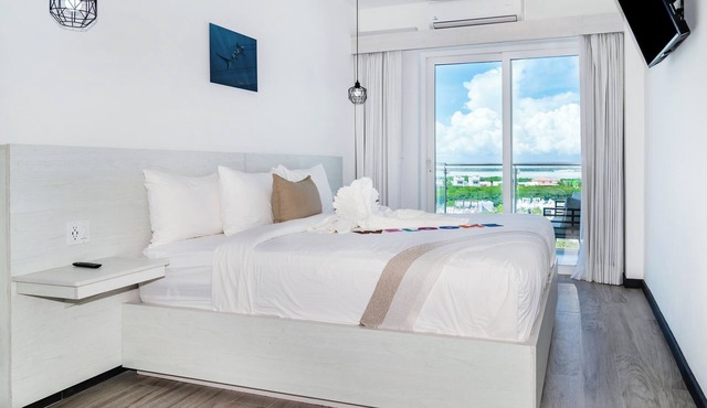 Sunset Suite 501 | Lagoon-View 1BR with Balcony at The Watermark Hotel in San Pedro