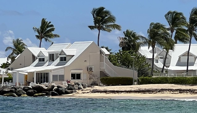 Sweet Home SXM Baie Nettlé Feet in the water on the beach in Collectivité de Saint-Martin